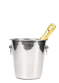 Bottle of champagne in cooler. Wgite background.
