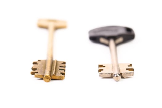 Two different key. Metal. Plastic. White background.