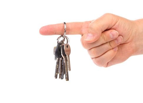 Hand holds bunch of keys. White background.