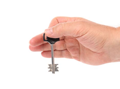 Hand holds modern steel-plastic key. White background.