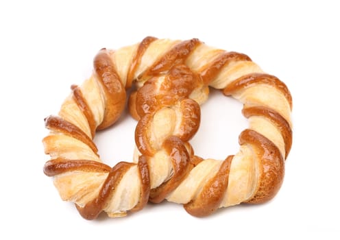 Knot-shaped biscuits on a white background. Close up.