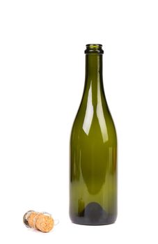Empty green glass bottle from champagne and cork