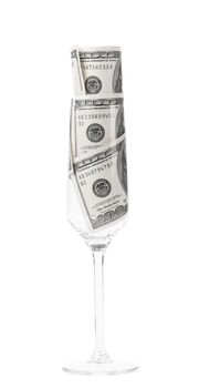 Wine glass with money. Isolated on a white background.