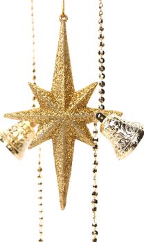 Golden christmas star and bells. White background.