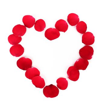 Beautiful heart of red rose petals isolated on white