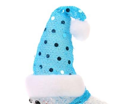 Santa claus hat on snowman. White background.