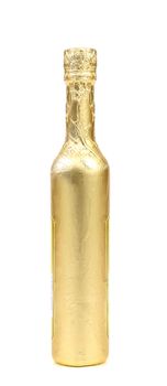 Bottle wrapped with gold foil. White background.
