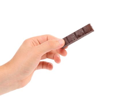 Hand holds chocolate bar. Isolated on a white background.