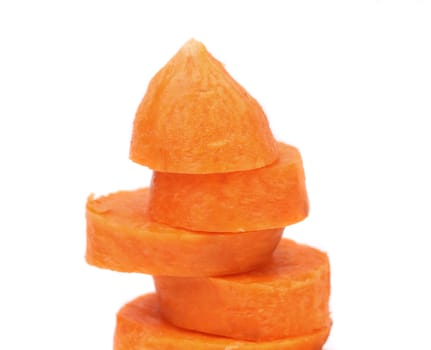 fresh carrot slices stack up on a white background