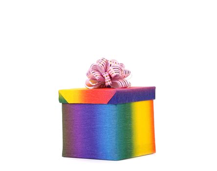Colourful present box and pink bow. White background.