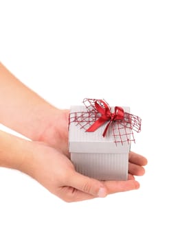 Silver gift box with red ribbon. White background.