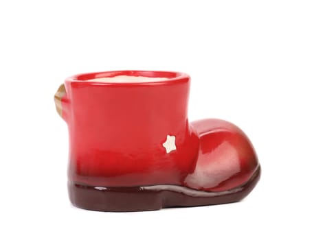 Red ceramic shoe isolated on a white background