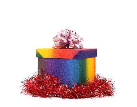 Colourful present box and pink bow. White background.