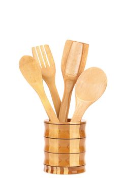 Wooden kitchen utensils in a jar. White background.