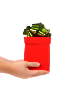Red gift box with green-golden bow. White background.