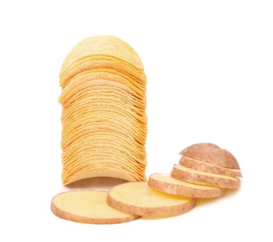 Potatoes slices and stack of chips. Isolated on a white background.