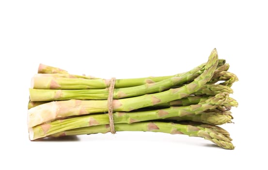 Fresh green asparagus bunch isolated on a white background