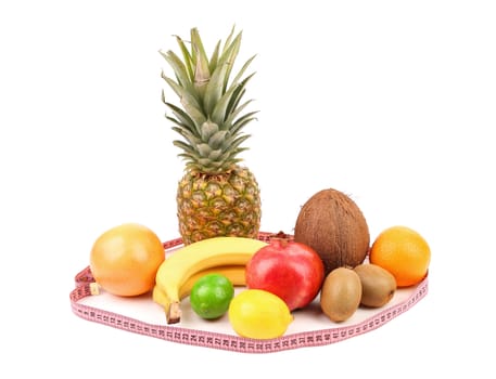 Tape measure and fruits composition. White background.