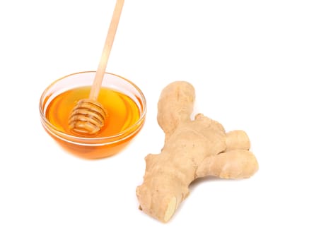 Root Ginger sliced and bow of honey. White background.