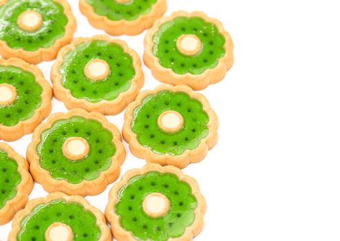 Background of biscuit with kiwi jam. Close up.
