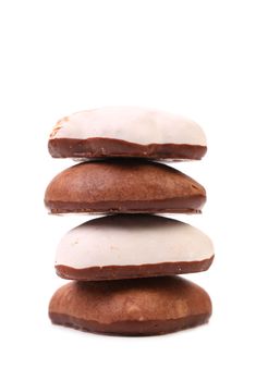 Stack of chocolate meringues.   Isolated on a white background.