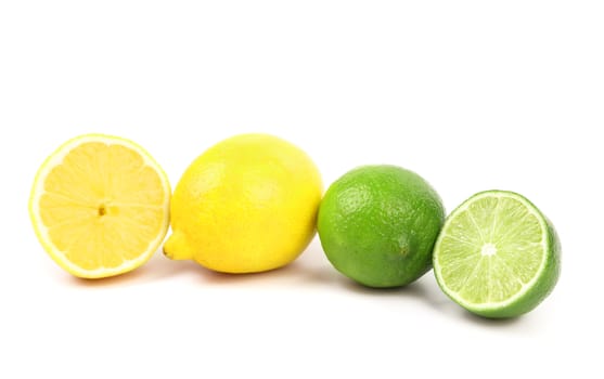 Fresh limes and lemons. Slices. White background.