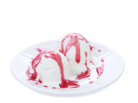 White ice cream and red syrop on a plate. White background.