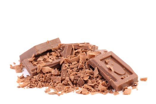 Chocolate bars and shaving. Isolated on a white background.