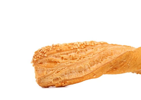 Just baked crunchy puff pastry with sesame. White background.