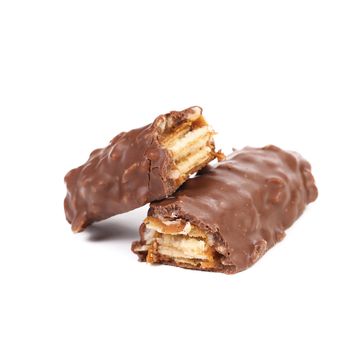 Broken chocolate bars with filling. White background.
