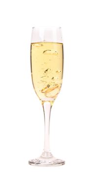 Wedding rings in a glass of champagne. White background.
