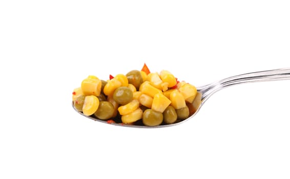 Spoonful with peas and corn isolated on a white background