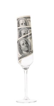 Champagne glass with money. Isolated on a white background.