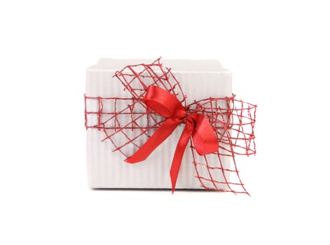 White gift box with red ribbon bow isolated on white