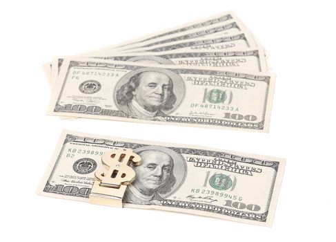 One hundred dollars banknotes in money clip. White background.