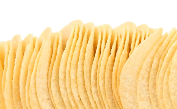 Background of potato chips. Close up. White background.