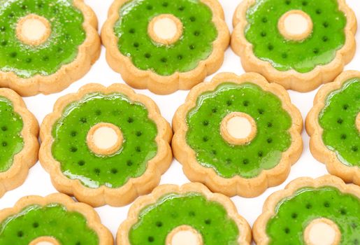 Background of biscuit with kiwi jam. Close up.