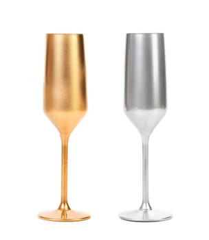 Golden and silver champagne glasses. White background.
