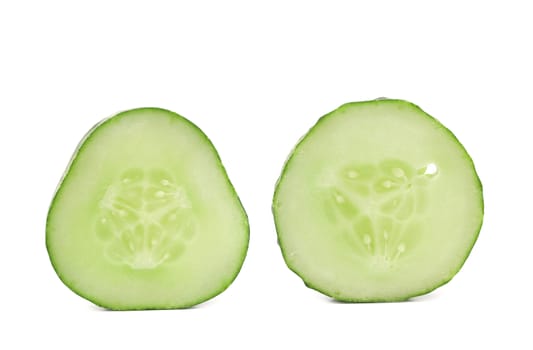 Fresh slices of cucumber on a white background