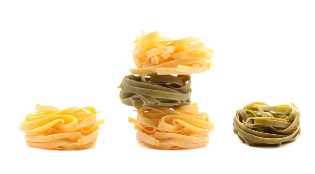 Tagliatelle paglia e fieno tipycal italian pasta. White background.