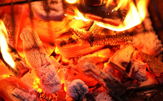 Blazing fire in Grilled. Close up. Whole background.