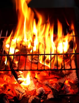 Blazing fire in Grilled. Close up. Whole background.