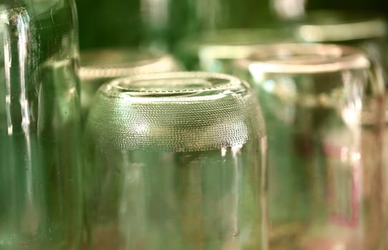 Grooved bottom of glass jar. Blurred background.
