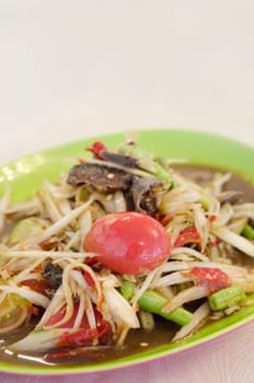 close up spicy papaya salad with crab and vegetable 