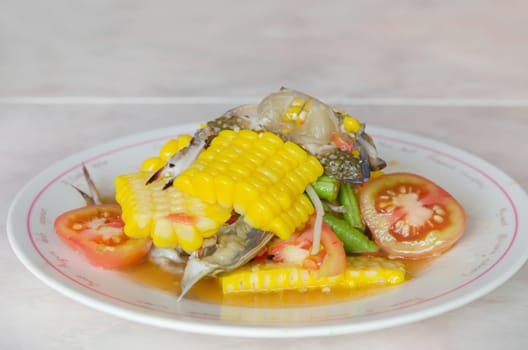 sweet corn  spicy salad with raw crab on dish