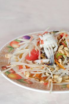 close up spicy papaya salad with crab and peanut, asian spicy dish