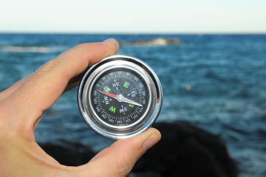 Orientation Concept a Male Hand Holding a Metal Compass