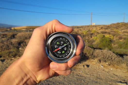 Orientation Concept a Male Hand Holding a Metal Compass