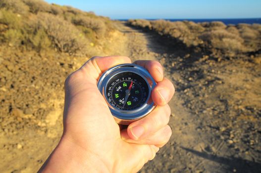 Orientation Concept a Male Hand Holding a Metal Compass