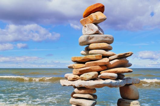 Balancing of pebbles each other on the seacoast